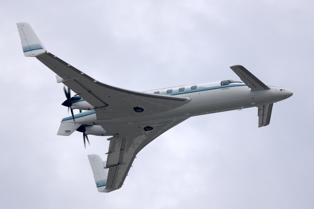 The innovative layout of the rear wing, forward canard, and pusher props is evident in this aerial photo of the Starship. (Ken Mist)